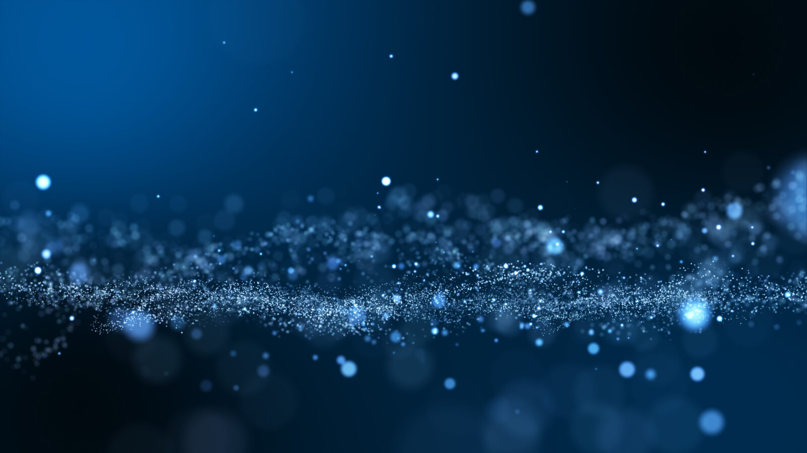 Una imagen abstracta y onírica de partículas azules brillantes que evocan un cielo estrellado o una escena submarina. Puntos brillantes de diversos tamaños flotan sobre un fondo azul intenso, creando una sensación de profundidad y tranquilidad.